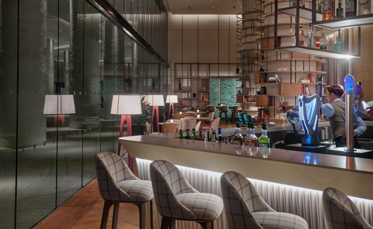 Amari SPICE Penang Hotel Bayan Lepas Bagian luar foto The bar at the hotel